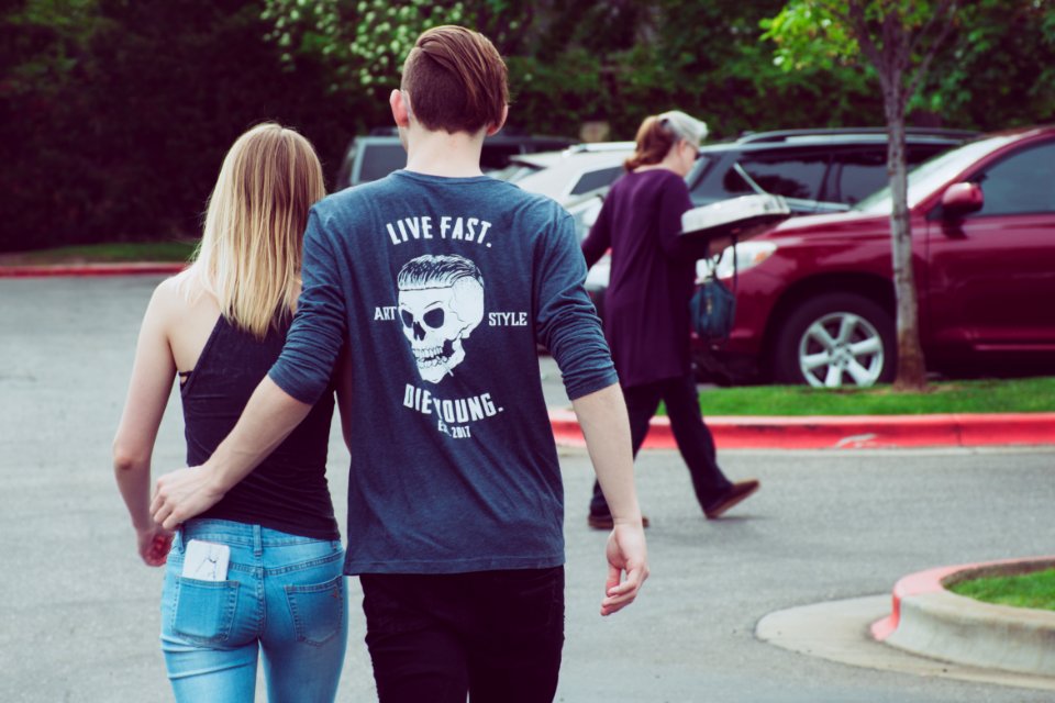 Man Wearing Gray Long-sleeved Shirt With Woman Wearing Black Camisole Top