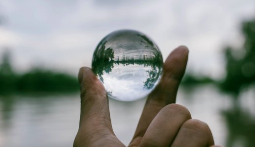 Close-Up Photography Of Person Holding Crystal Ball