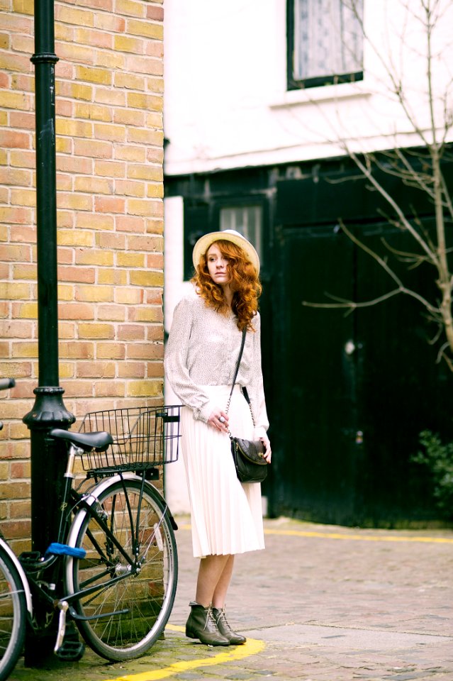 Woman Wearing White Long-sleeved Dress Near Bicycle