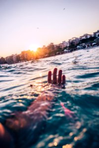 Person Swimming At The Beach