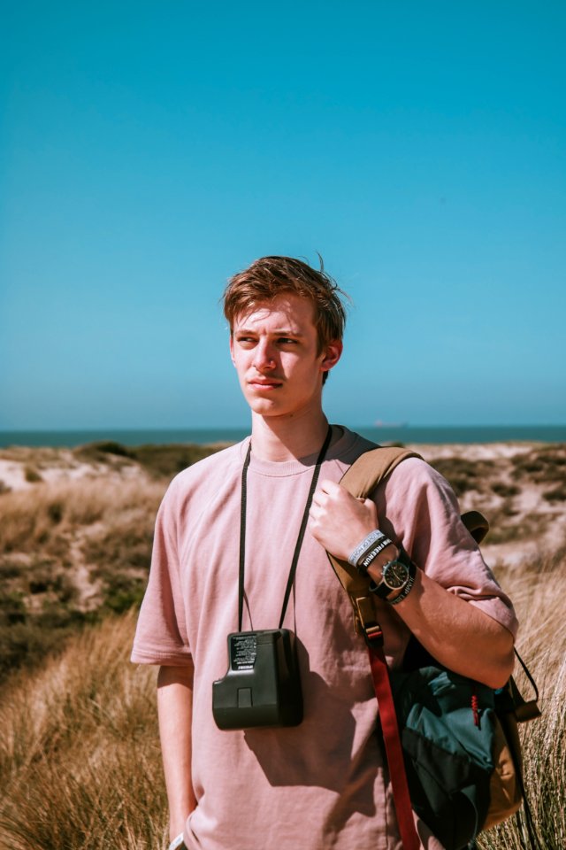 Photography Of A Man Carrying Bag