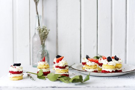 Strawberry And Blackberry Tarts On A Plate