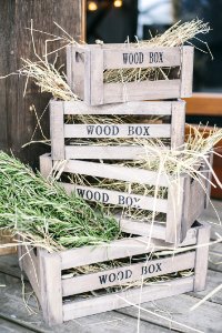 Four Stacks Of Brown Wooden Crates With Hays photo