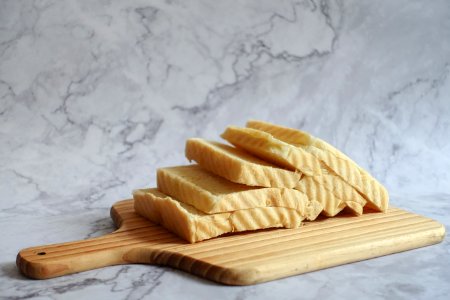Slice Bread On Brown Chopping Board