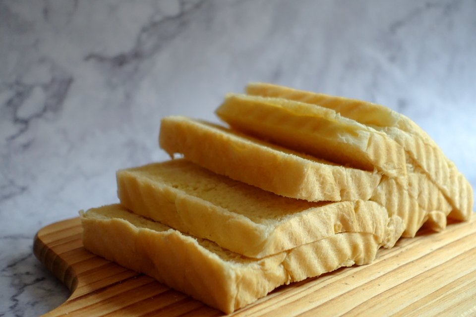Sliced Loaf Bread On Chopping Boar