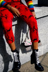 Person In Red Pants And Pair Of Black Heeled Boots