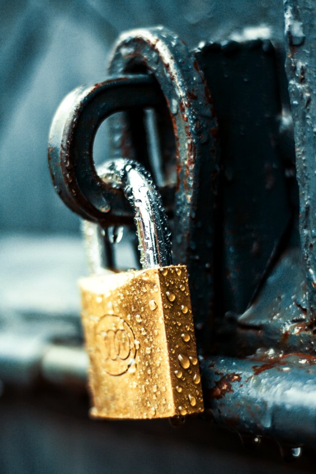 Close-Up Photography Of Wet Padlock photo