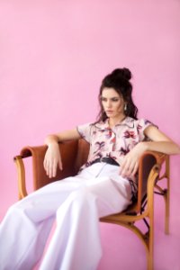 Photography Of A Woman Sitting On Chair photo