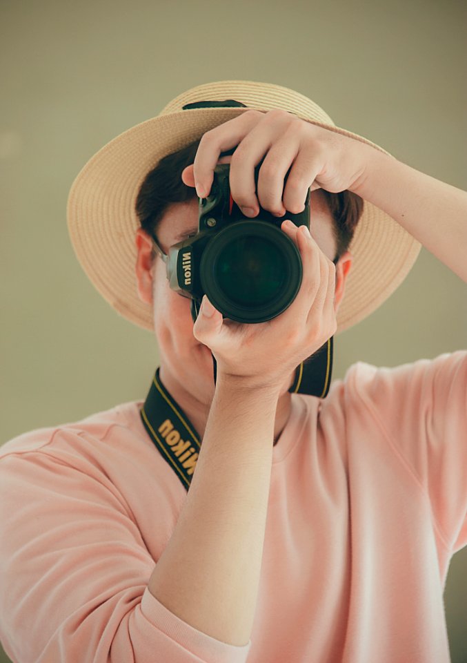 Man Holding Nikon Dslr Camera