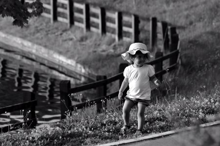 Monochrome Photography Of Toddler On Flowers