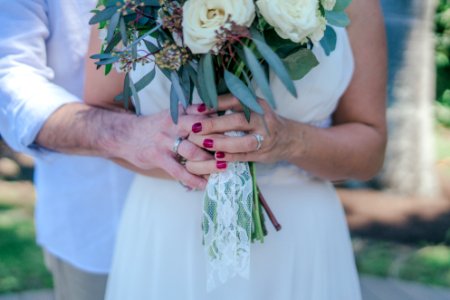 Woman Holding White Bouquet photo