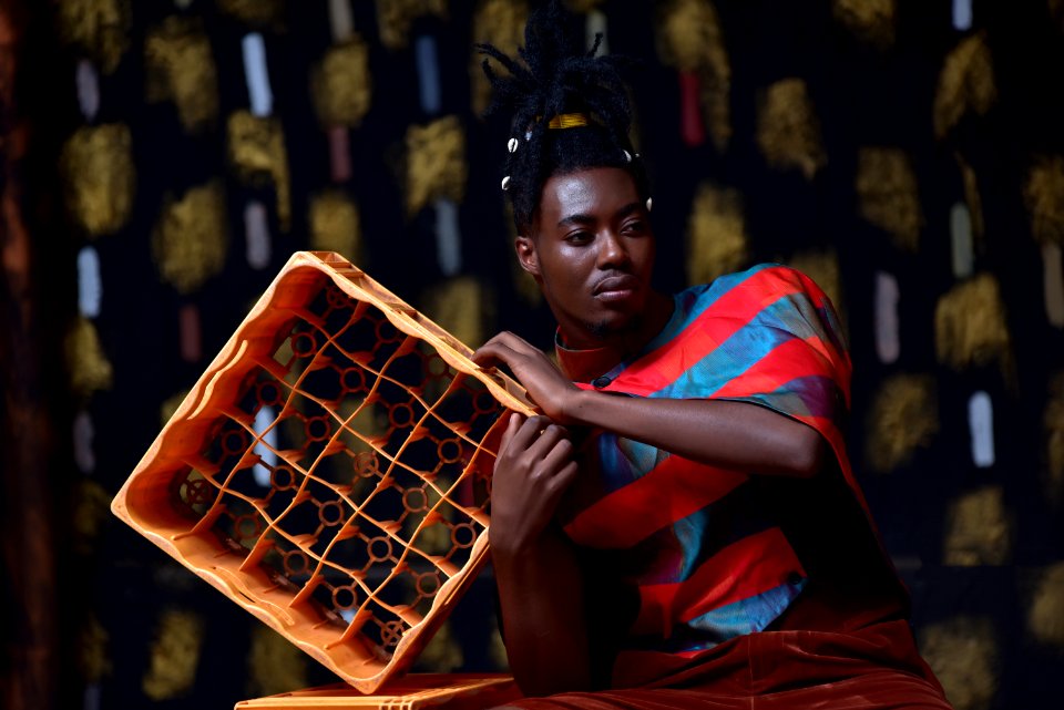 Photo Of Man Holding Plastic Bottle Crate