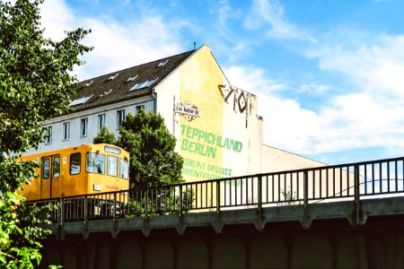 Yellow Train Beside Teppichland Berun Building