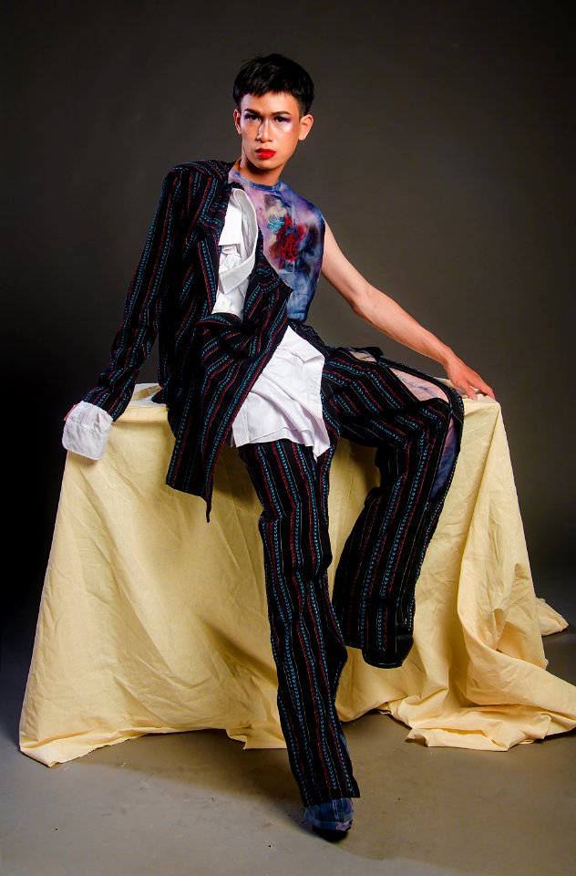 Photography Of Man Wearing Multi-colored Pinstripe Outfit
