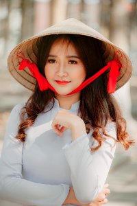 Photography Of A Woman Wearing Asian Conical Hat photo