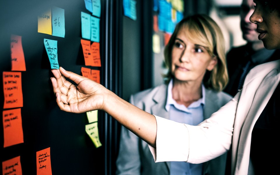Woman Holding Sticky Note