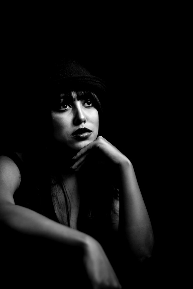 Grayscale Photo Of Woman Wearing Black Hat photo