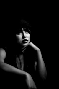 Grayscale Photo Of Woman Wearing Black Hat