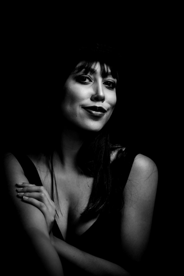 Greyscale Photo Of Woman Wearing Tank Top And Hat