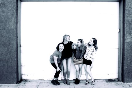 Grayscale Photography Of Four Women Wearing Clothes photo