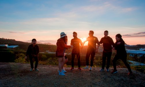 People Gathering During Sunset