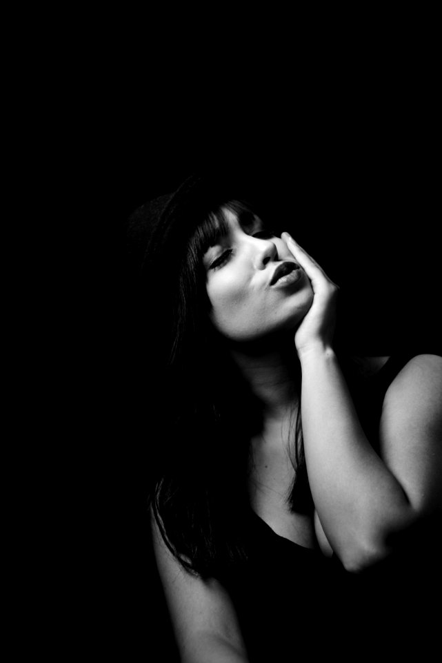 Grayscale Photography Of Woman In Tank Top Wearing Hat