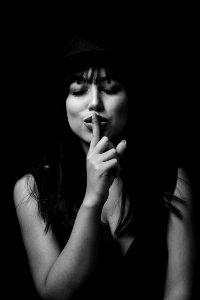 Monochrome Photography Of Woman Doing Silent Gesture