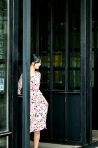 Black Haired Woman In Pink And Black Floral Dress photo