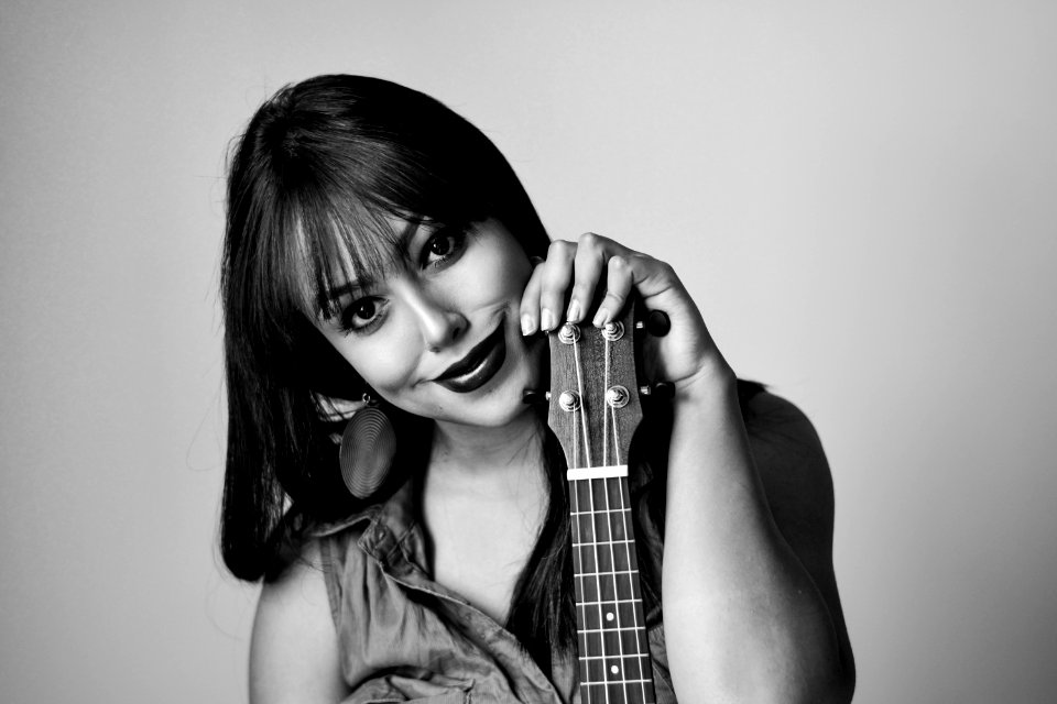 Photography Of A Woman Holding Ukelele