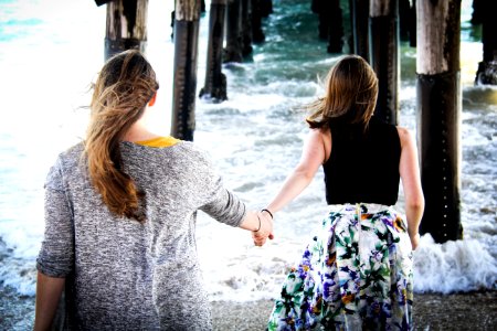 Photography Of Women On Seashore
