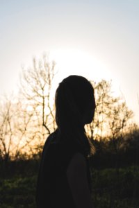 Silhouette Of Woman During Sunset photo