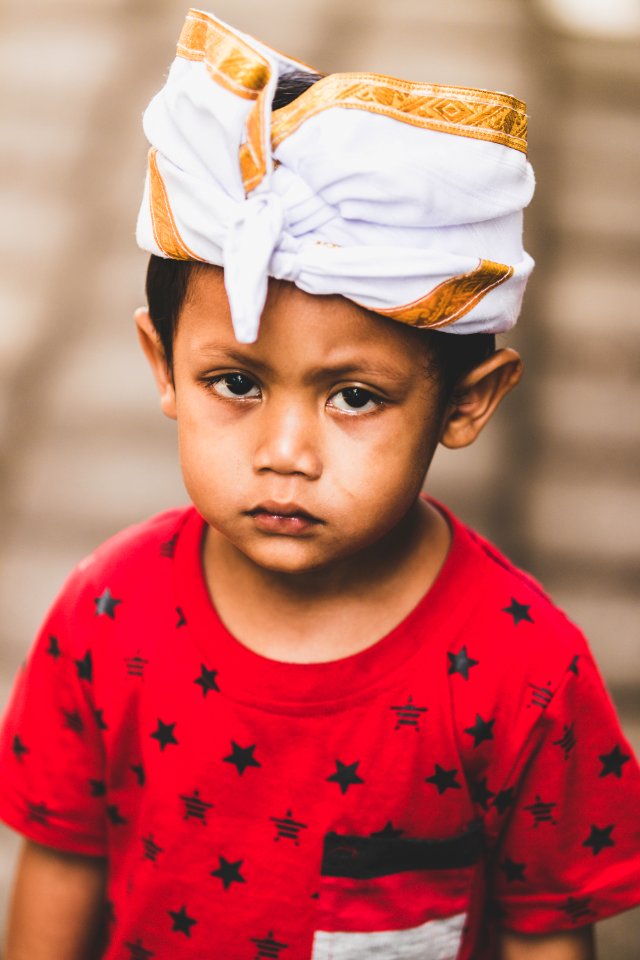 Boy Wearing Red And Black Star Print Crew-neck T-shirt Selective Focus Photography