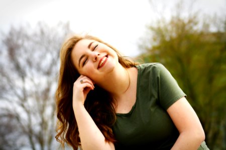 Woman In Green Shirt Smiling photo