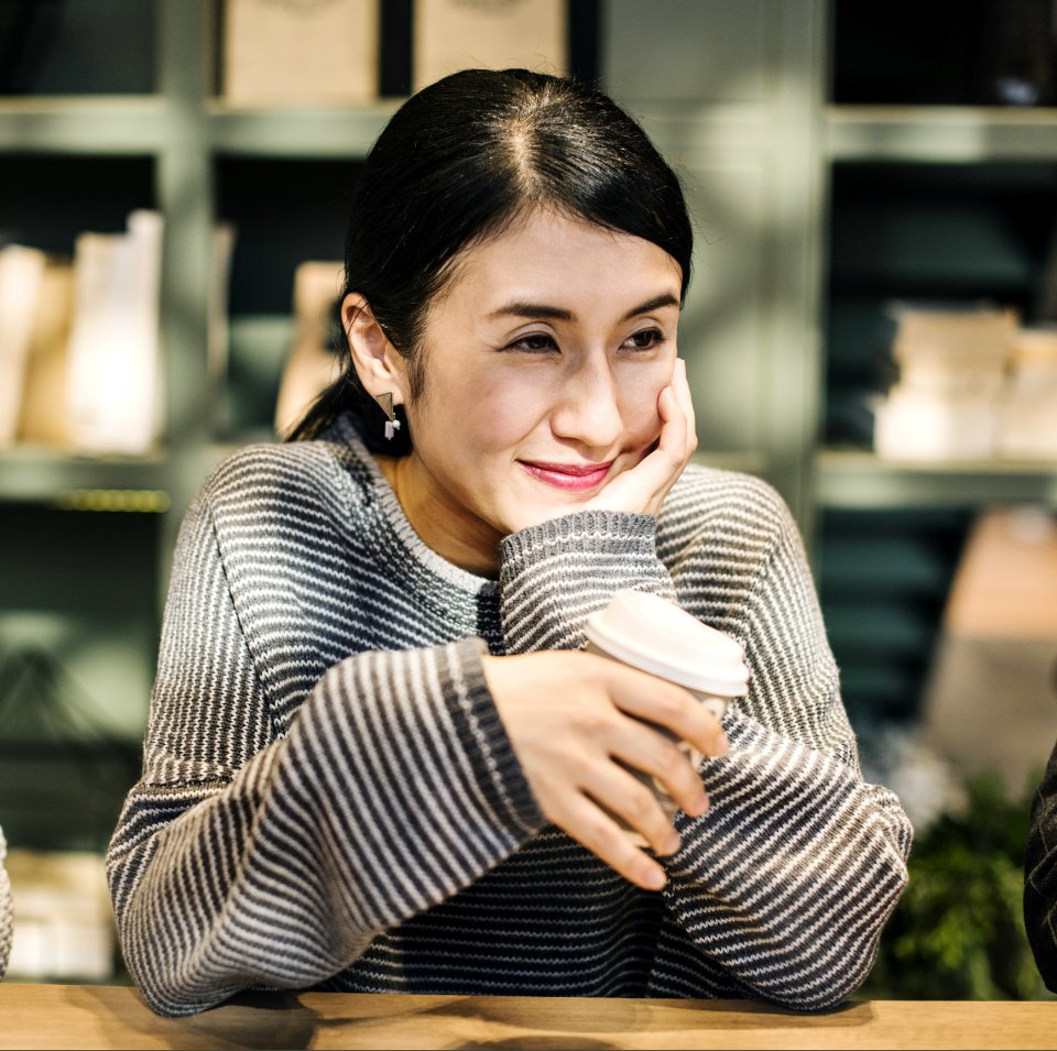 Photography Of A Smiling Woman Wearing Sweater photo