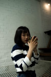Photo Of Woman Wearing Black And White Stripe Top