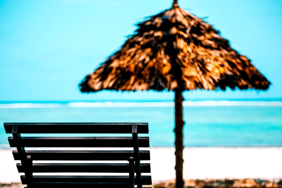 Beach Lounge Chair With Straw Parasol