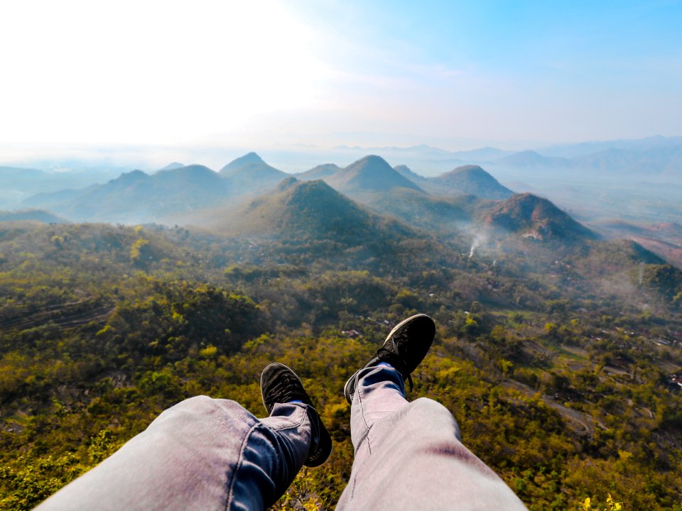 Closeup Photo Of Persons Foot Near Mountain