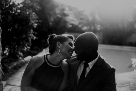 Grayscale Photo Of Couple At Garden Near Pool photo