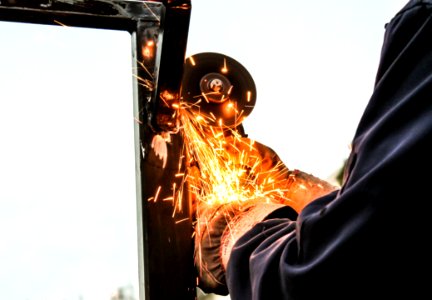 Person Holding Angle Grinder photo