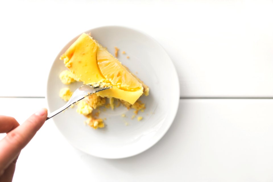 Sliced Dessert On Top Of White Ceramic Plate photo