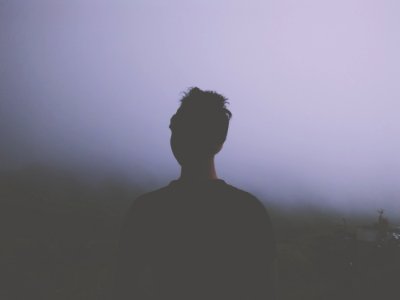 Man Standing Facing White Fogs photo