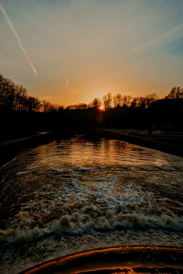 Silhouette Of Water Body And Trees