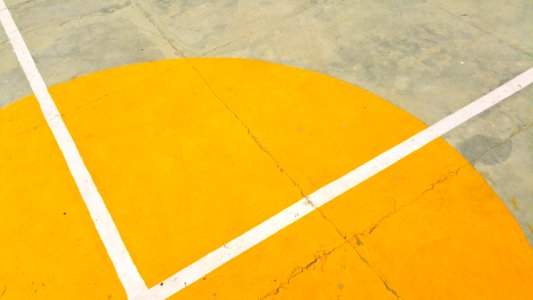 Gray Concrete Pavement With Yellow And White Paint photo