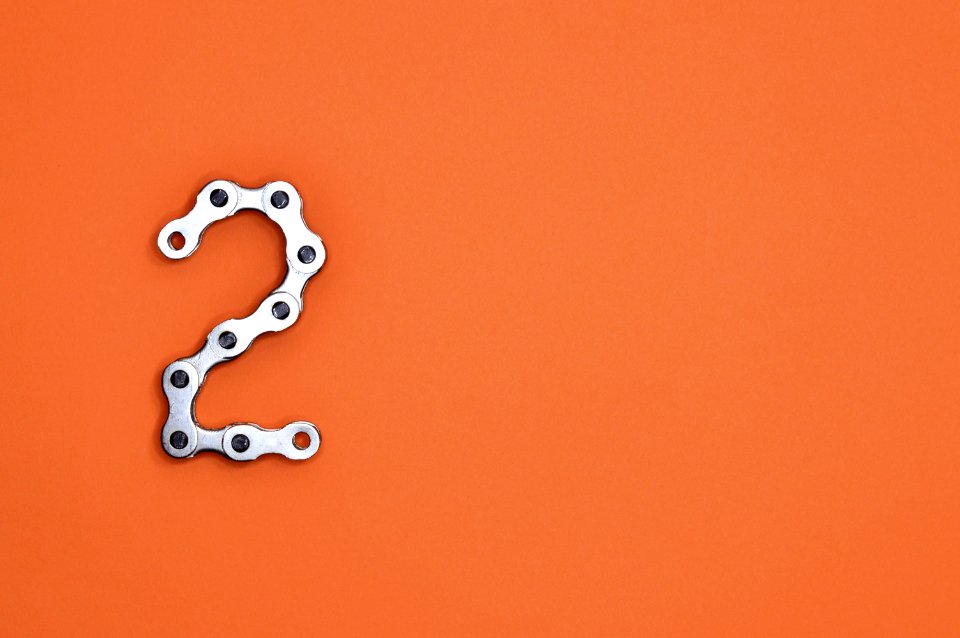 Gray Steel Chain On Orange Surface
