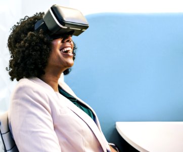 Woman Wearing White Robe And Black Virtual Reality Headset photo