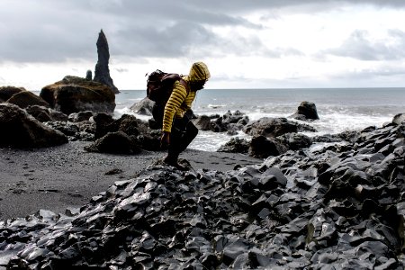 Photo Of Man In Yellow Hoodie Near Seashore photo