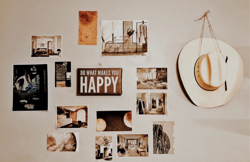 Photo Of Brown And White Photo Frames Hang In Wall