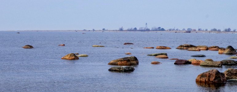 Brown Rocks On Body Of Water