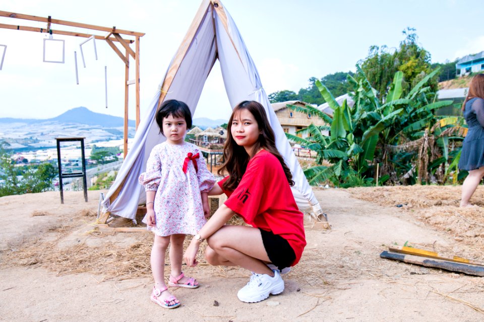 Woman Beside Gift In Front Of Tent