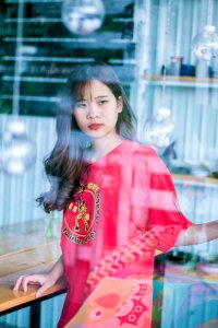 Woman Wearing Red Crew-neck Shirt photo